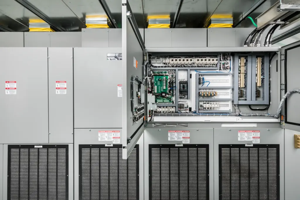 Open control section of a medium-voltage drive lineup showing wiring and control boards