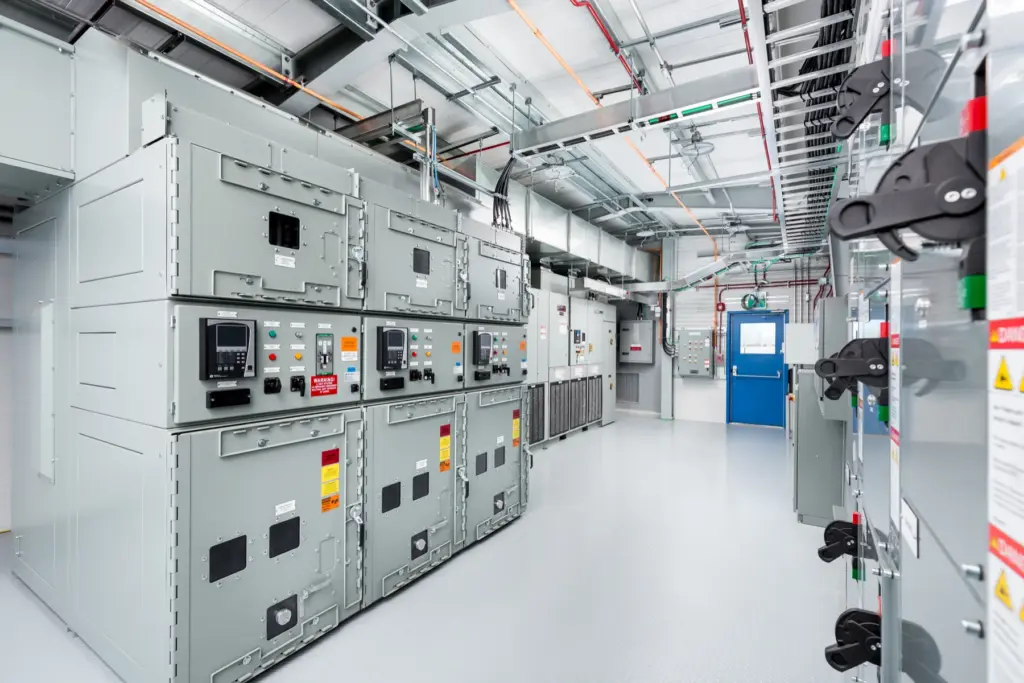 Aisle between motor control and switchgear lineups inside an electrical building